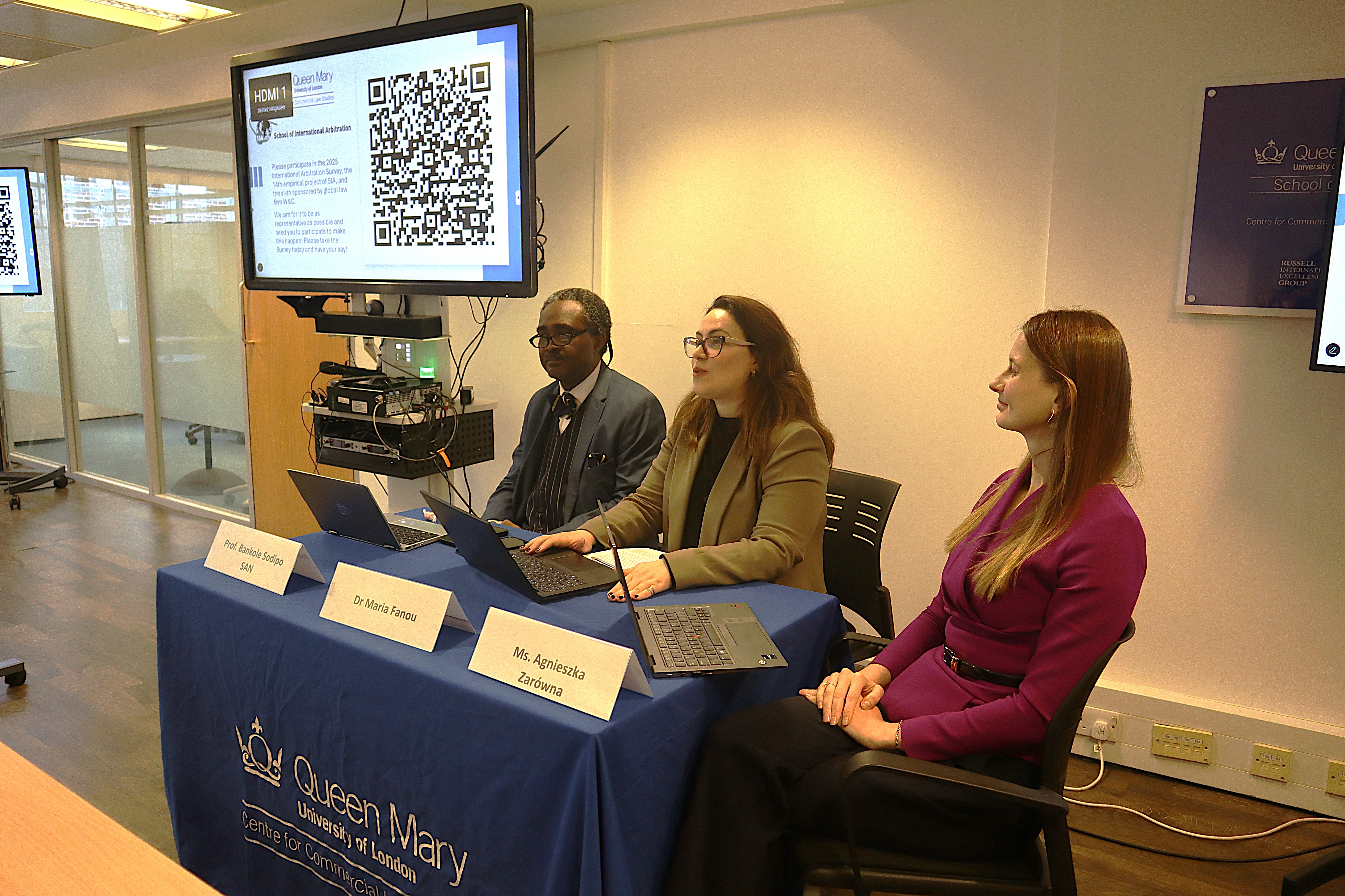 3 panelist sitting at a panel table