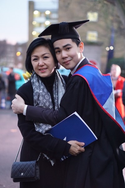 Photo of alumnus, Pike Dechapunta, at his graduation ceremony