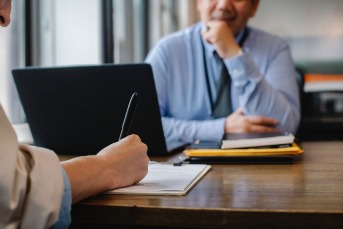 A man being coached in an executive setting