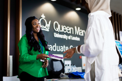 A staff member handing out leaflets