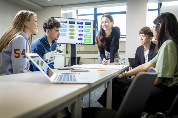 Students working around a table