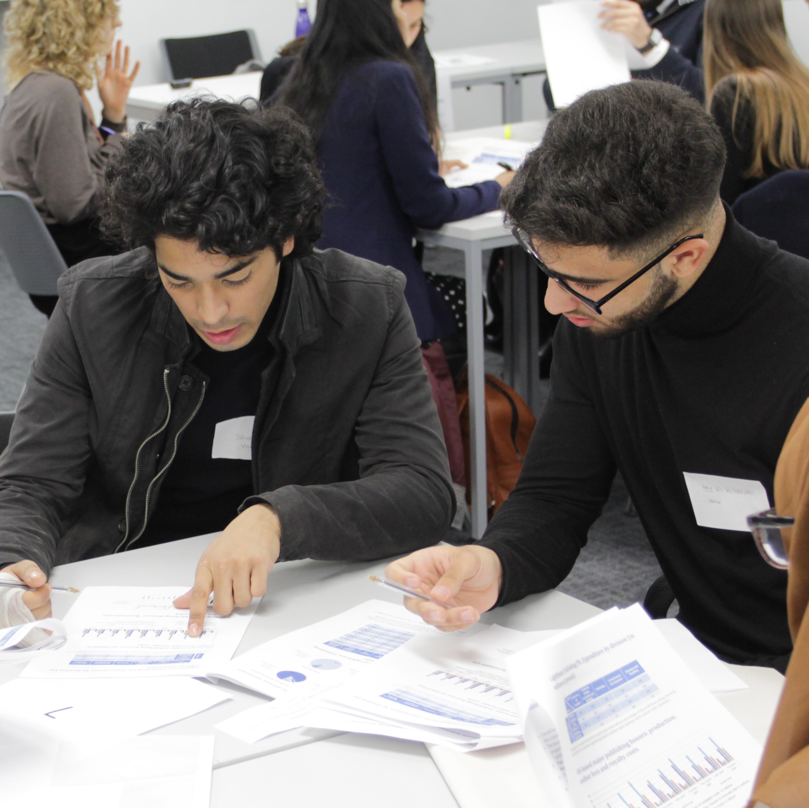 Two students sat at a table working