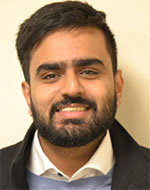 Kunal Bindra smiling, wearing a jacket and white shirt