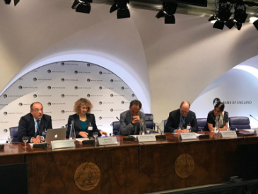 Five men and women sit on a panel at the sixth annual CCLS-Bank of England conference 