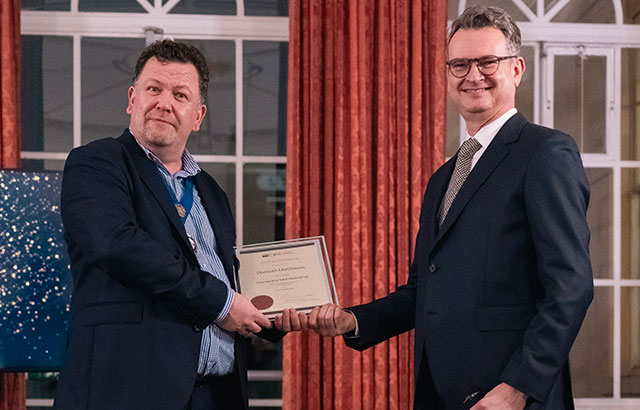 Professor Duncan Matthews receiving his honorary award from CIPA President, Matt Dixon.