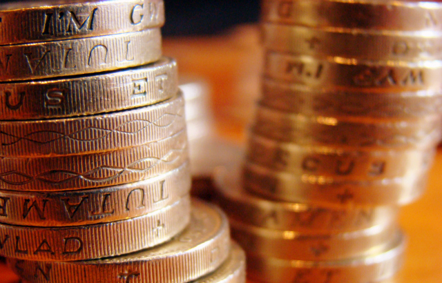 Some pound sterling coins stacked in columns