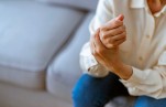 Woman holding her wrist. Credit: ljubaphoto/iStock.com