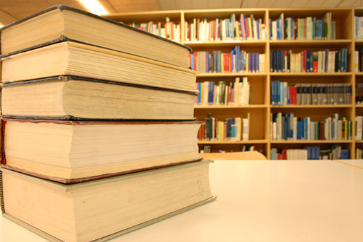 Books arranged on a table in a library