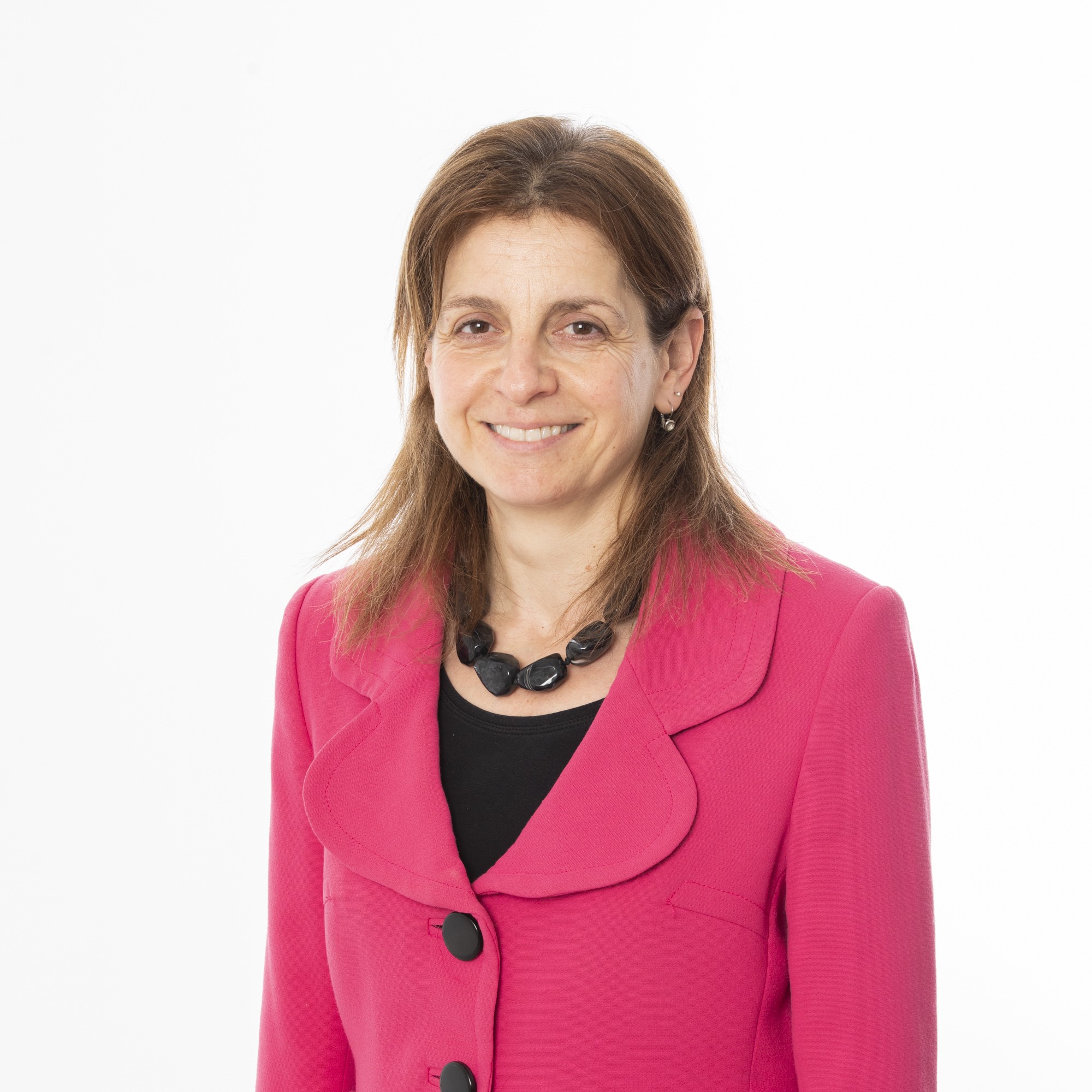 Image of Professor Maralyn Druce wearing pink jacket and black top