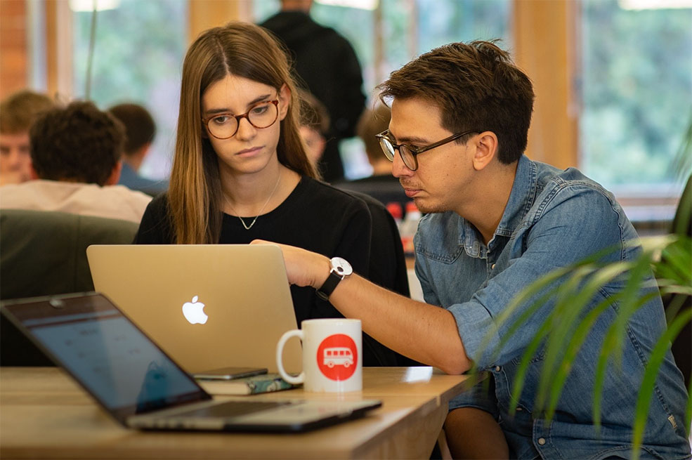 2 students working together on laptop