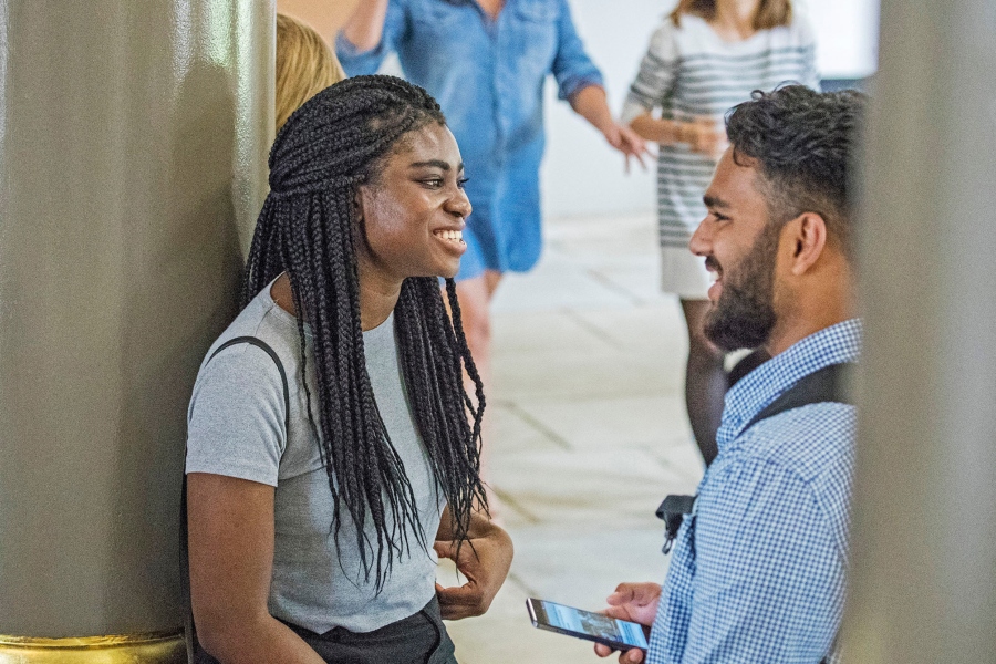 Two students chatting to each other