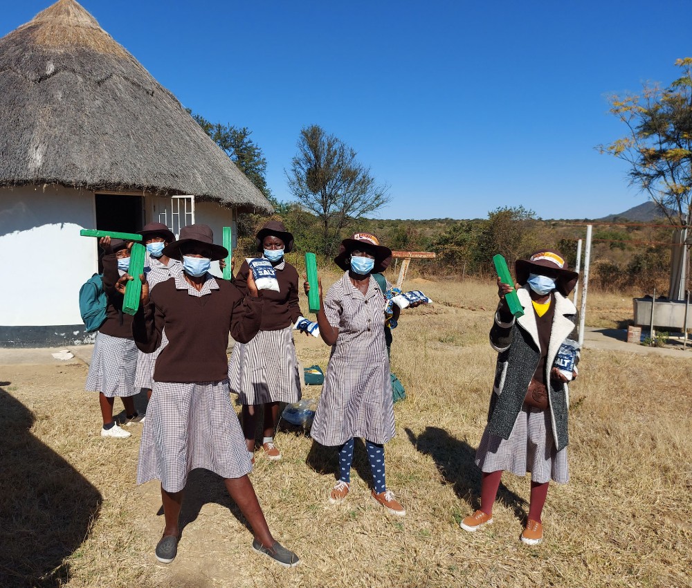 Zimbabwean workers with gifts