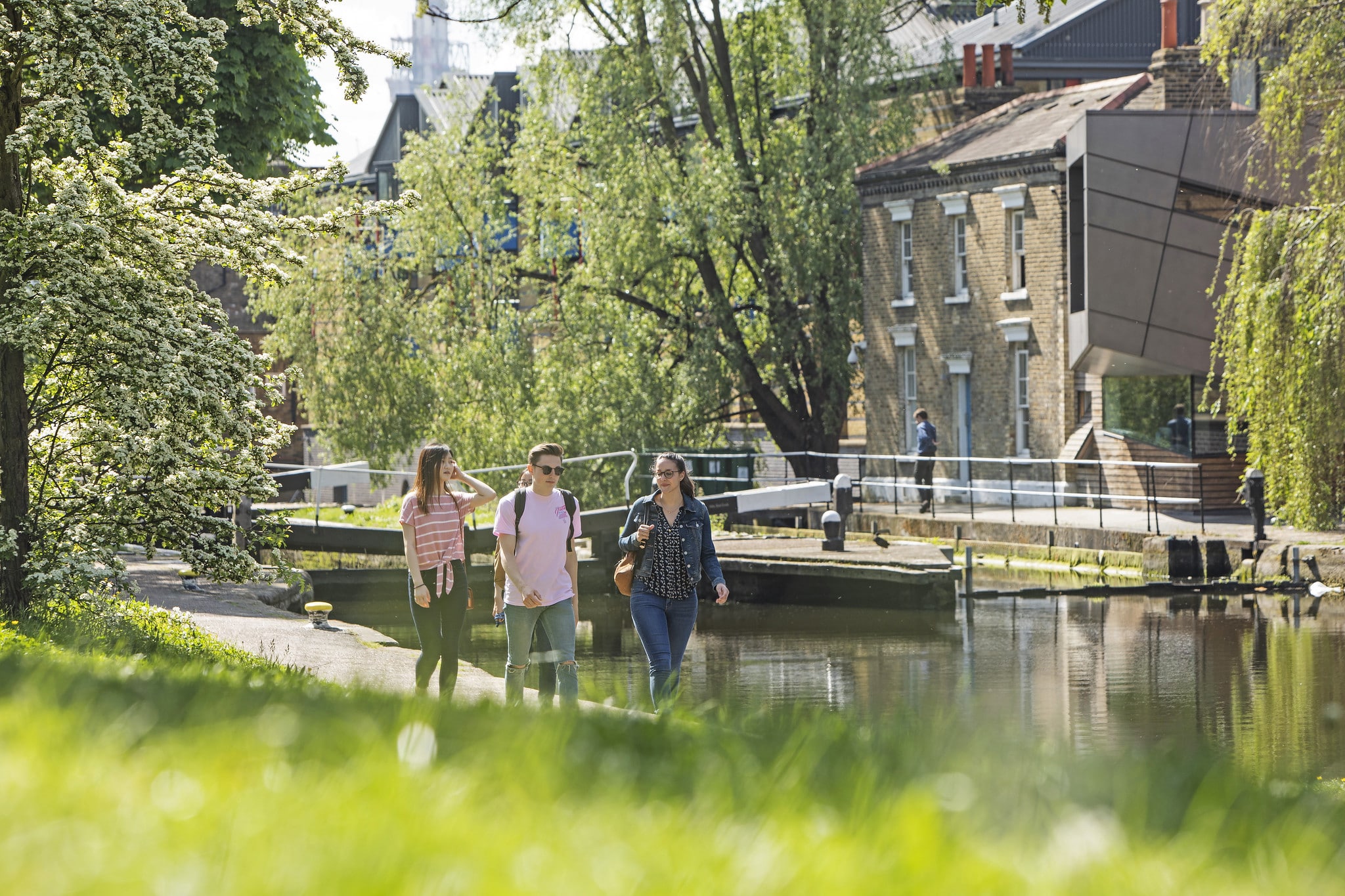 Students walking by canal