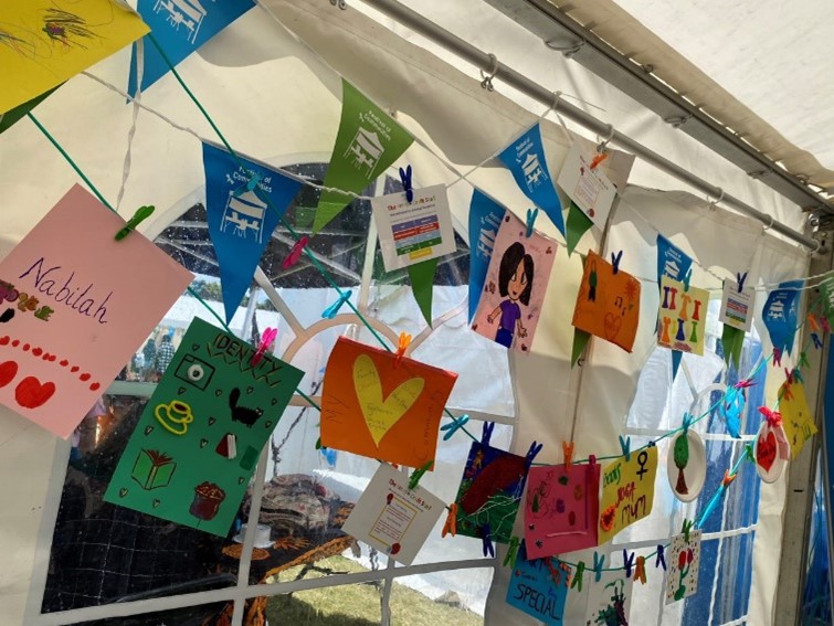 A bunch of decorated cards by children at the LAC's I Am You stall at the Queen Mary Festival of Communities.