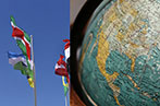 Image of flags blowing in the wind on the left and a globe on the right