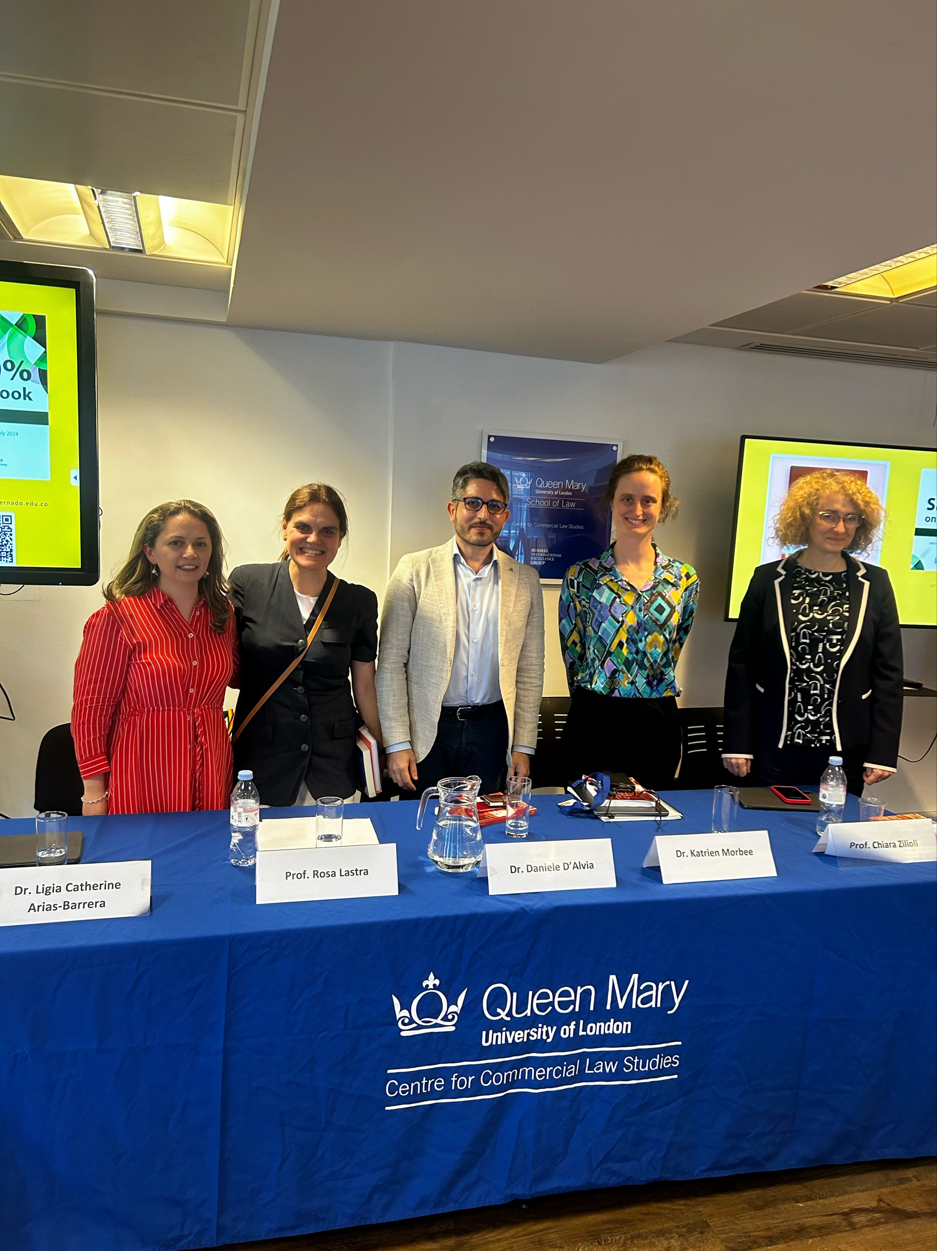 5 speakers sitting on a panel table 2