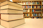 Books arranged on a table in a library