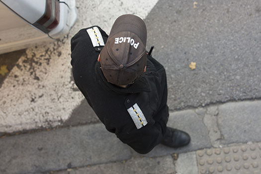 Looking down on a Police Officer in uniform