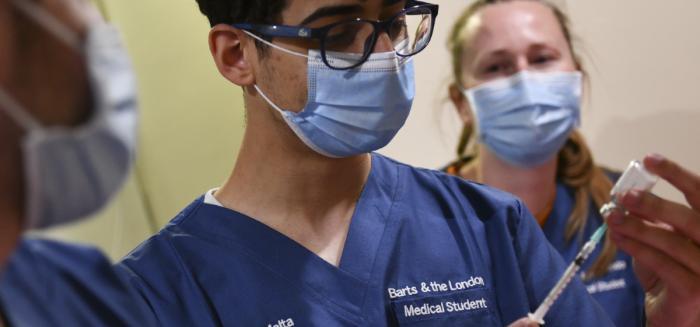 Medical Students administering vaccine