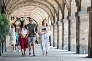 Students walking along a veranda