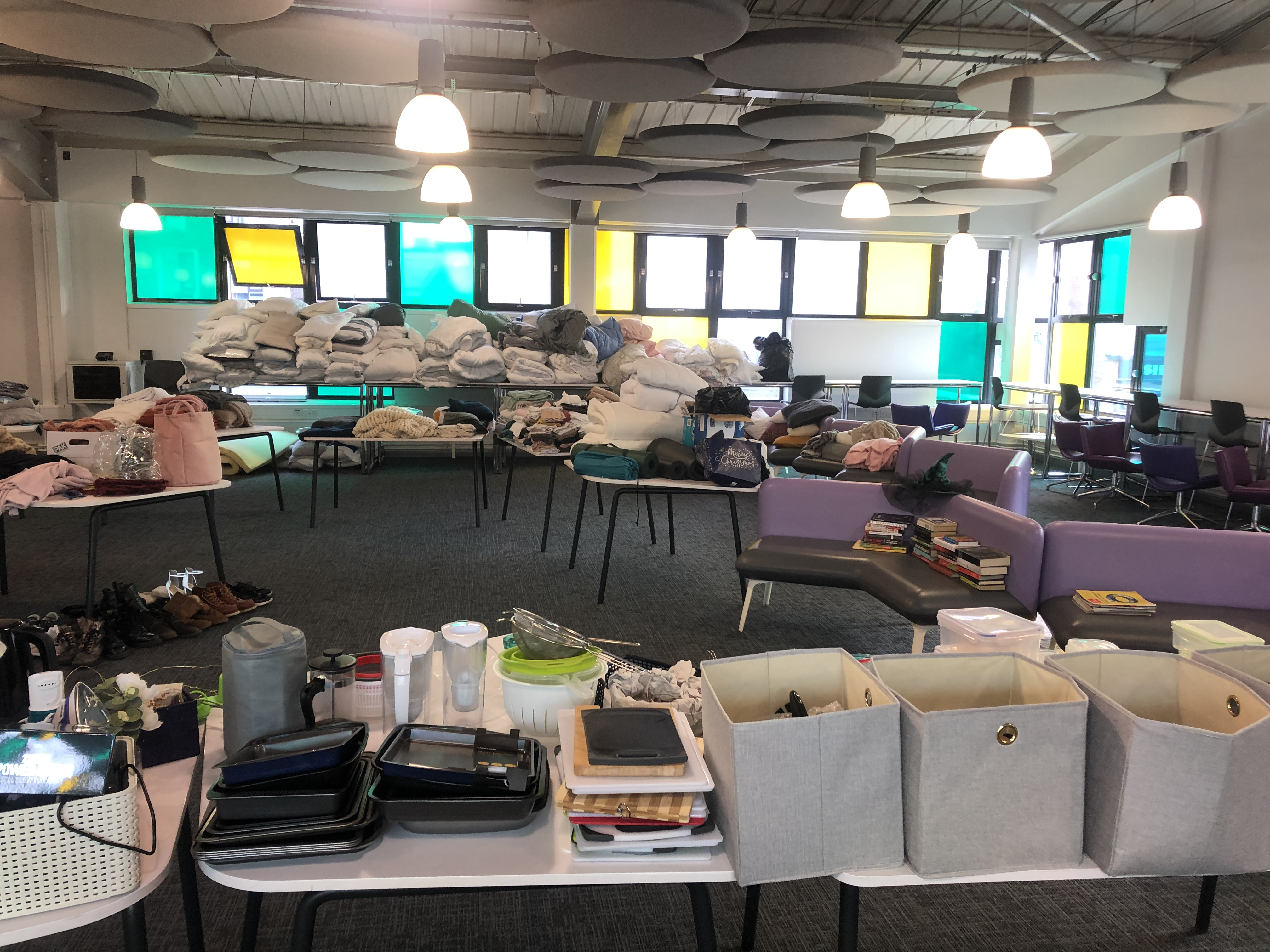 An image showing bedding, crockery and electrical items arranged on tables at the September 2021 Reuse Fair
