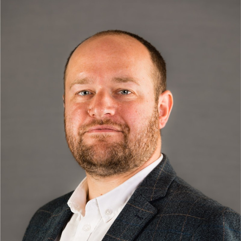 Headshot of alumnus, Alex Barrow