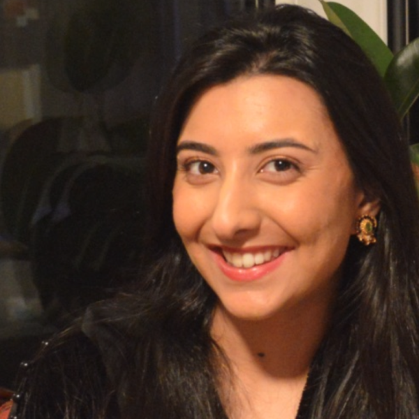 Headshot of alumna, Anum Ahmed, smiling at the camera