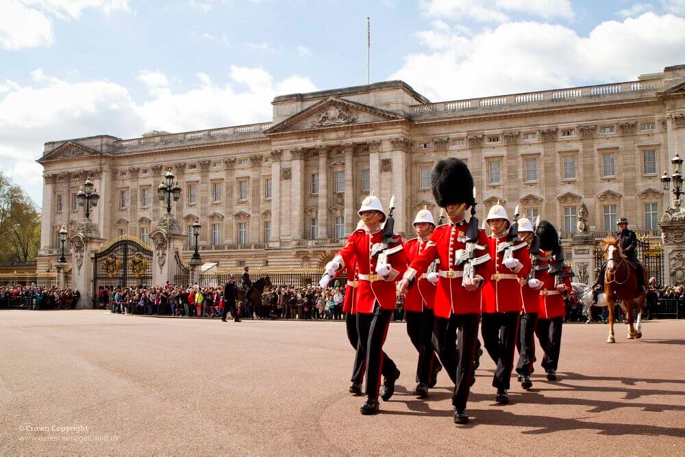 Royal guards marching outside Buckingham Palace