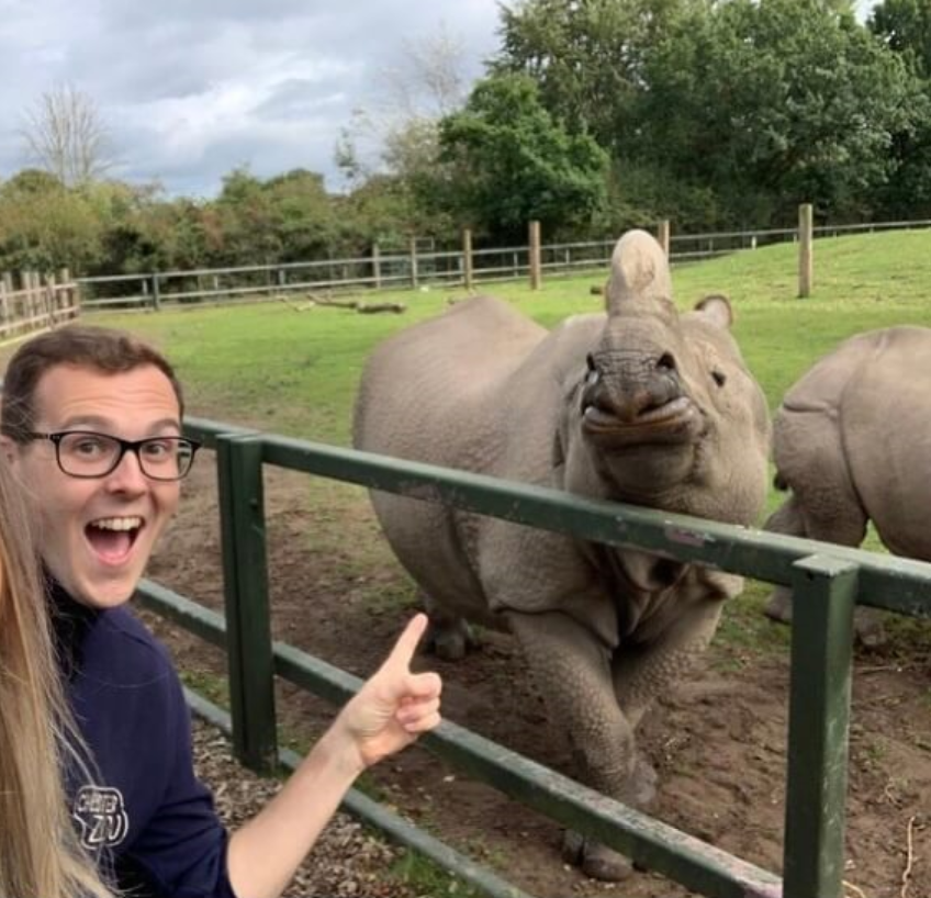 Alumnus Dan Harrold with a rhino