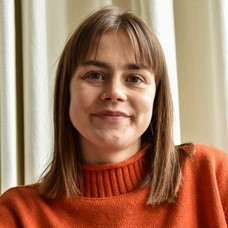 Headshot of alumna, Evie Lewis