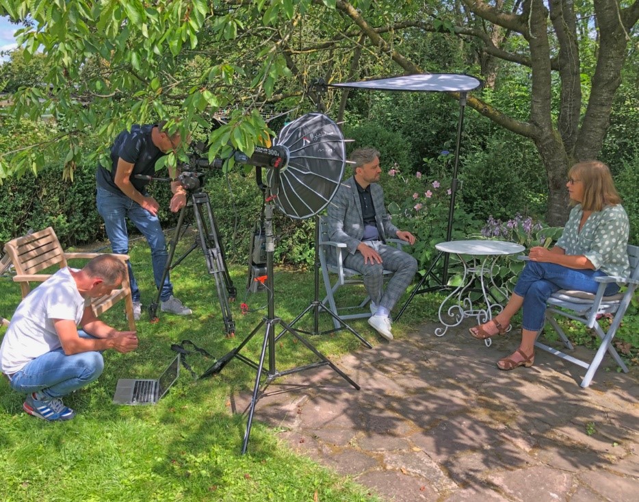 Photo of alumnus, Dr John Goodyear, filming documentary, Happy Birthday Niedersachsen