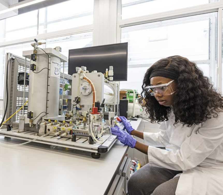 Female student conducting experiments in a laboratory at Queen Mary University of London