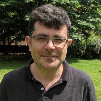 Professor Pedro Cutillas outside with greenery behind