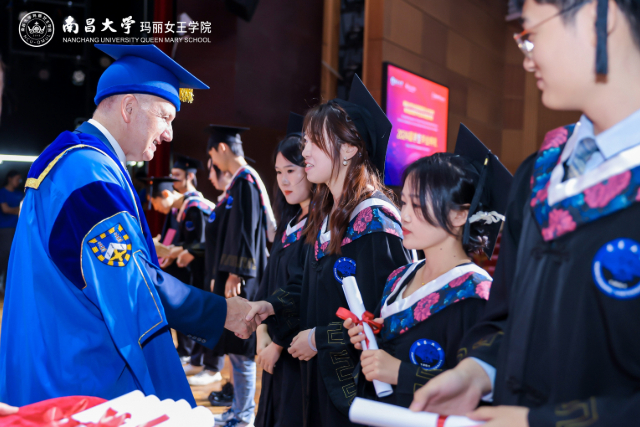 President and Principal Colin Bailey with students at the 2024 NCU graduation ceremony