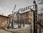 A photograph of the entrance to the Auschwitz concentration camp