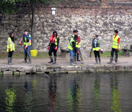 Students clearing litter from the canal