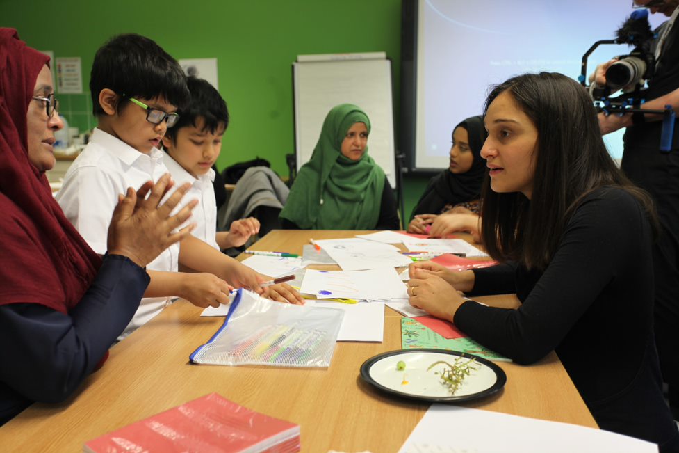 Members of the Stories from Home team having a conversation with young children about their heritage and languages