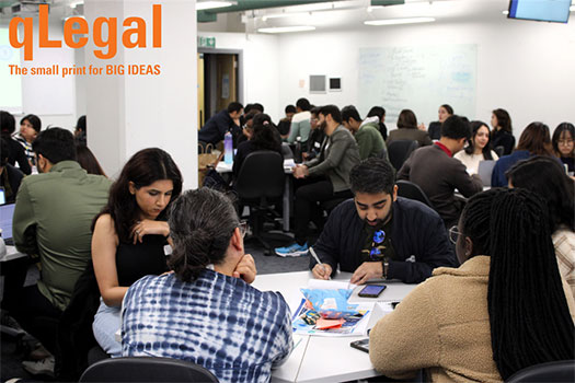 A table of qLegal students sat around a table in a workshop about clinical legal education.