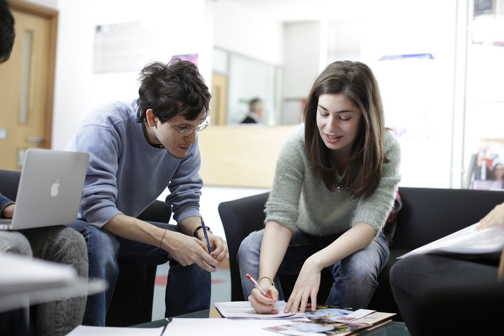 Two people sitting together in conversation