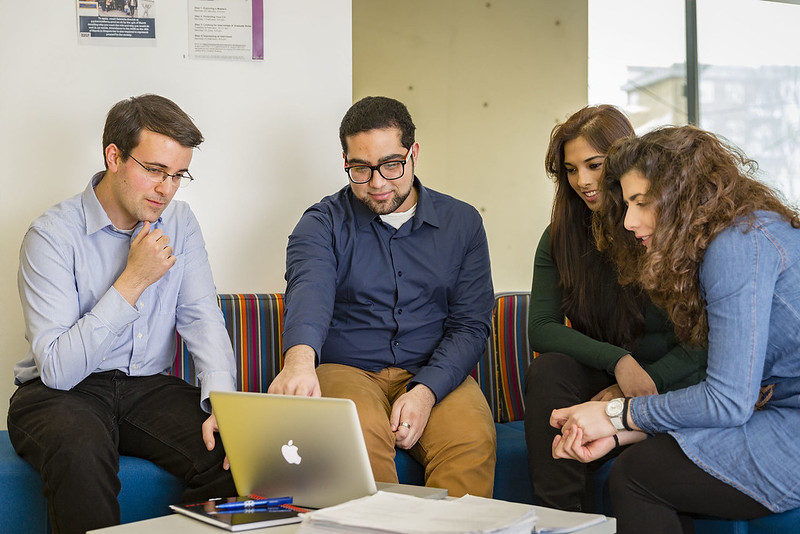 Students sit together talking