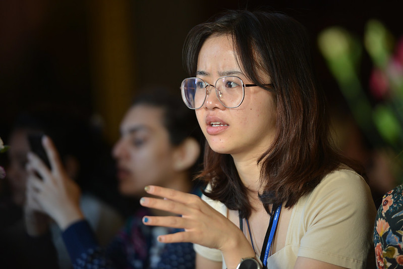 Student speaking with hands gesturing