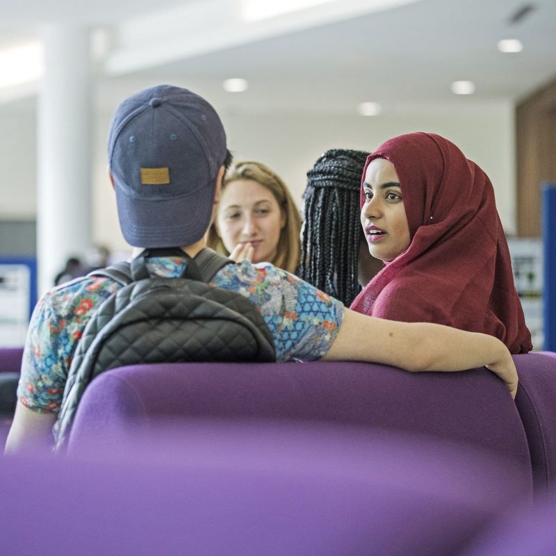 Queen Mary students sitting together in conversation