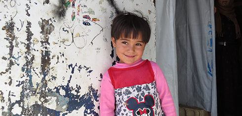 Young female child outside refugee camp