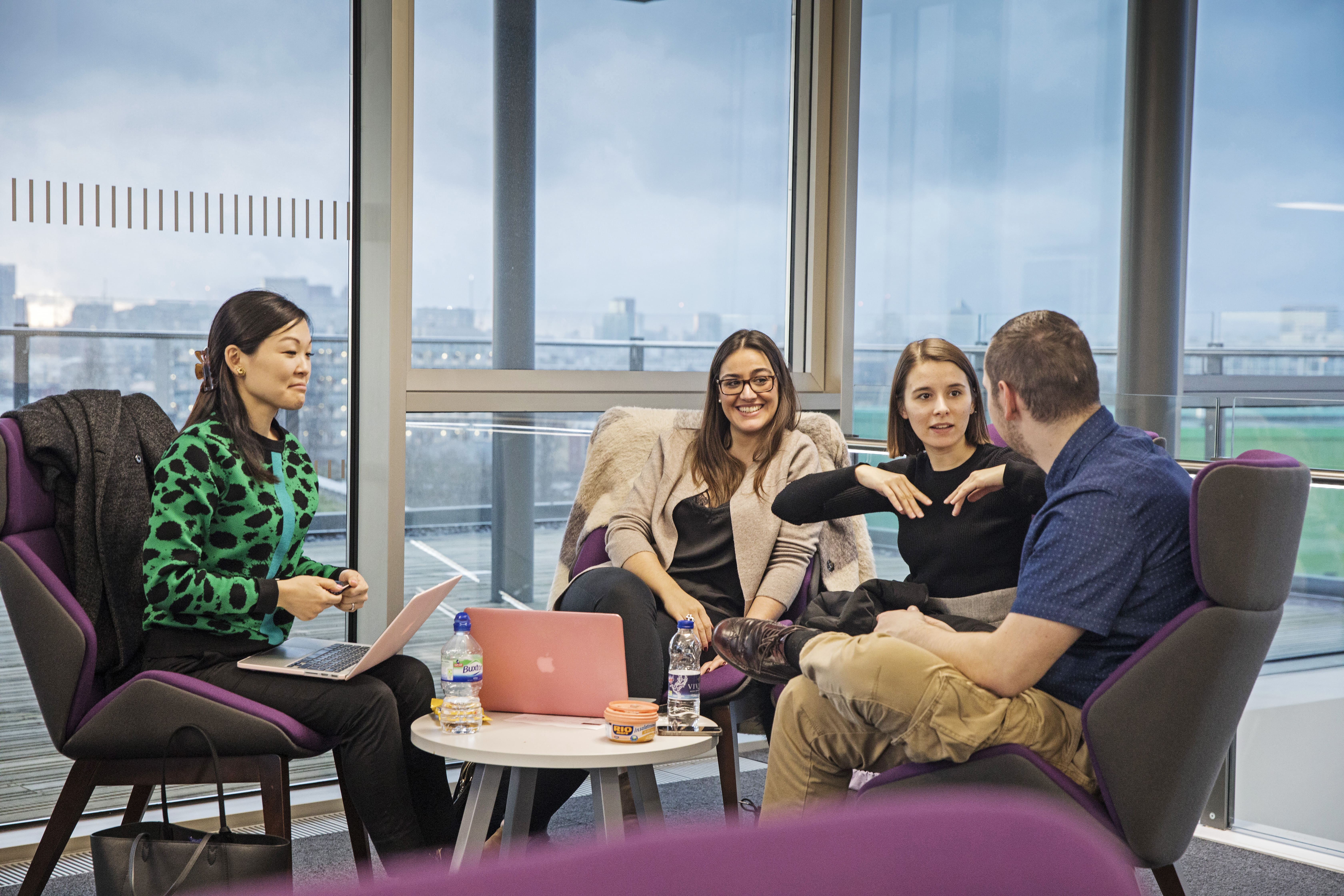 Male and Female Students Sitting in Graduate Centre