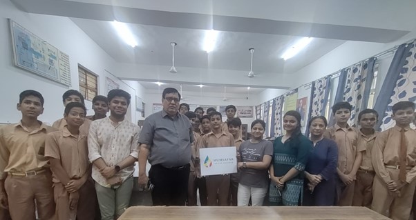 Image of Astitva, School Principal and students from the Humsafar project in a classroom.