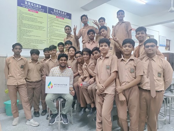 Image of Astitva and students from the Humsafar project in a classroom.