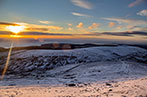 A sunrise over a snowy landscape on the Isle of Man