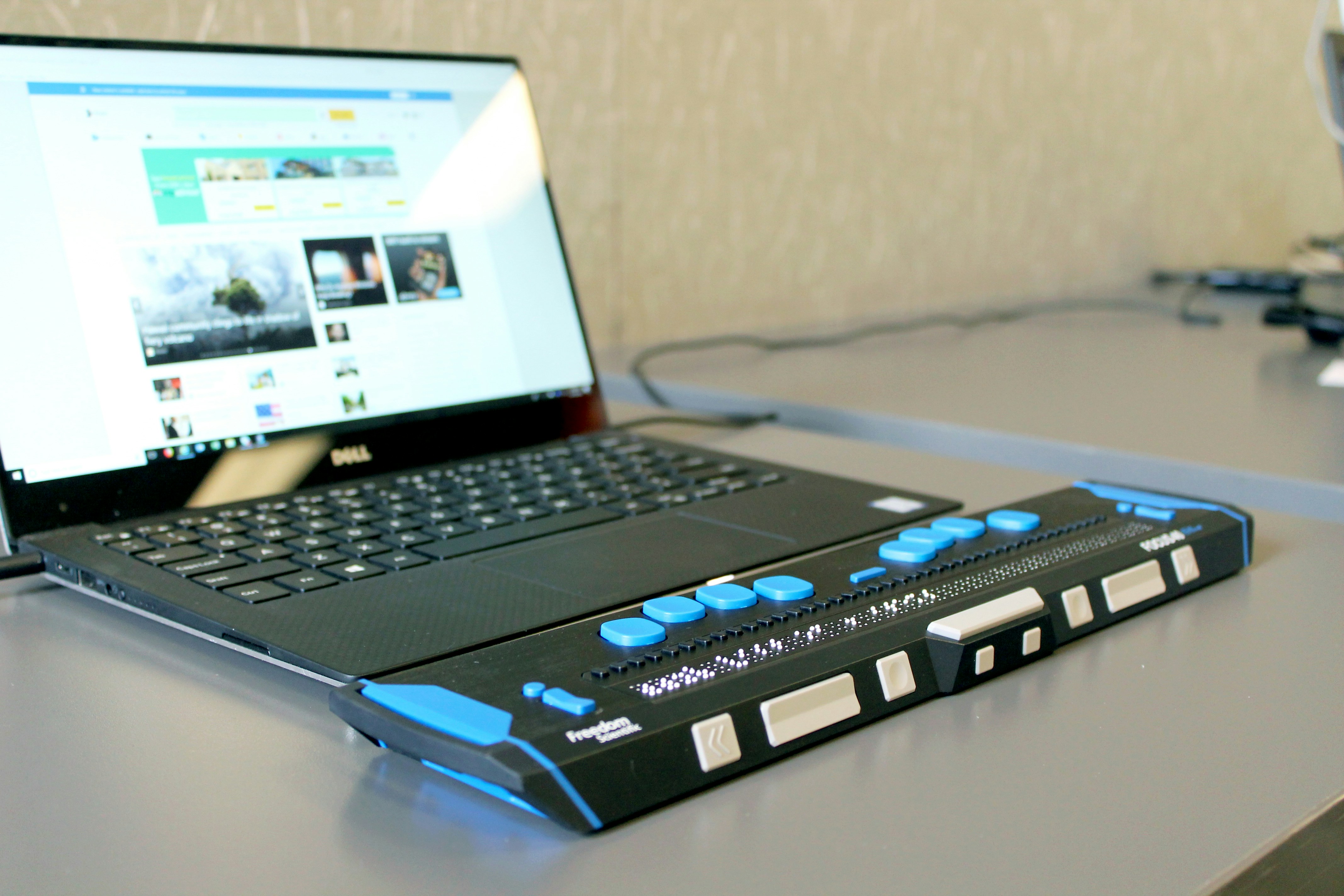 A laptop with a refreshable braille display.