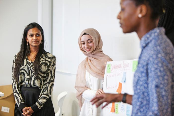 Three students in a discussion