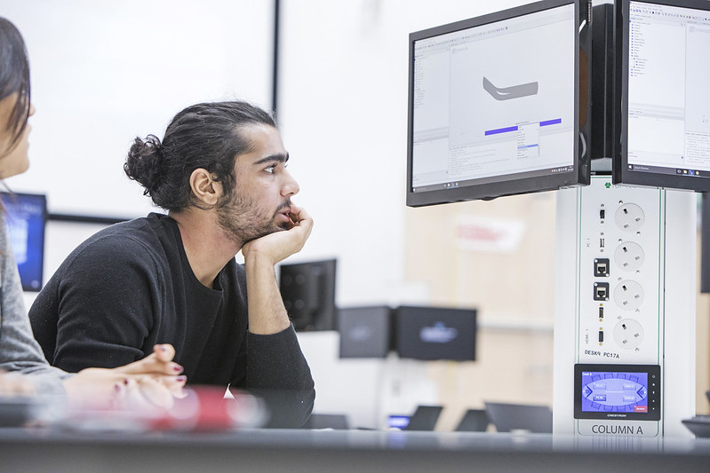 Student looking at external monitor